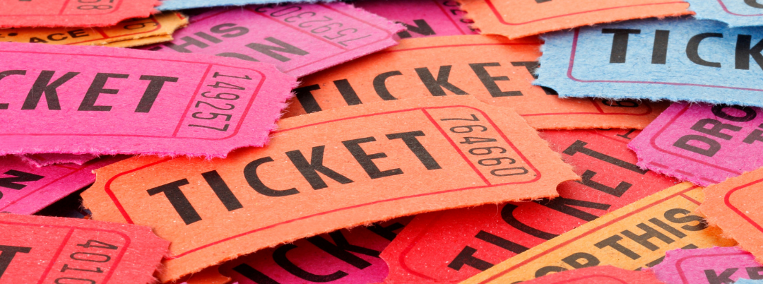 Brightly coloured admission tickets in a pile